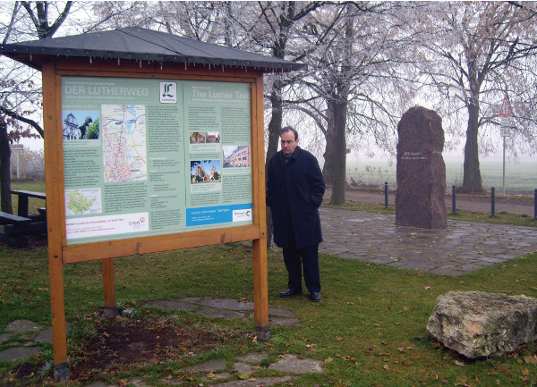 President Bugbee in the country near Stotternheim. The stone marking the place Luther “wasshown the way” stands behind him.