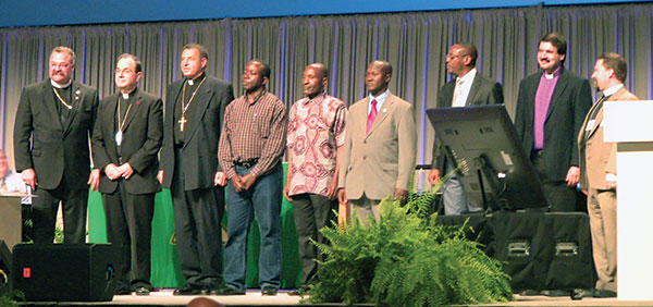 LCMS President Matthew C. Harrison (left) greets LCC President Robert Bugbee (second from left) and other church body leaders present at the LCMS Convention.