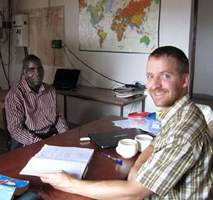 Rev. Mike Kuhn at work with his language resource person, A Muslim Nizaa named Yougouda Bah.