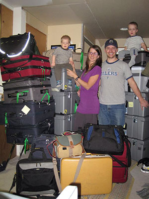 On the way to Cameroon: The Kuhns pose with their 14 checked bags and six carry-ons before departing for Cameroon.