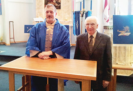 Rev. Richard Beinert and Al Judt following the December dedication of Al’s table.
