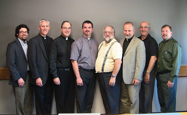 Current members of the CTCR meet in Winnipeg. (Left to right: Paul Walrath, Rev. Dr. Thomas Winger, President Robert Bugbee, Rev. Joel Kuhl, Rev. James Heinbuch, Rev. Warren Hamp, Clifford Pyle, and Rev. Dr. James Gimbel).