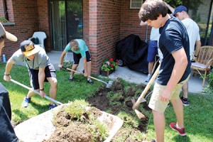 Youth beautify the grounds at CLTS.