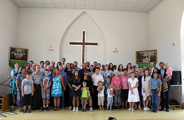 The congregation in Dn gathers to welcome Rev. Navrotskyy (far right in clerical collar).