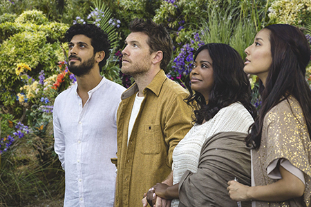 Mack Phillips (Sam Worthington—second from left) along with the The Shack's depiction of the Trinity: Jesus (Aviv Alush - left), Papa (Octavia Spencer -second from right), and Sarayu (Sumire Matsubara - right).